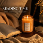 Embossed glass scented candle on a bedside table at night