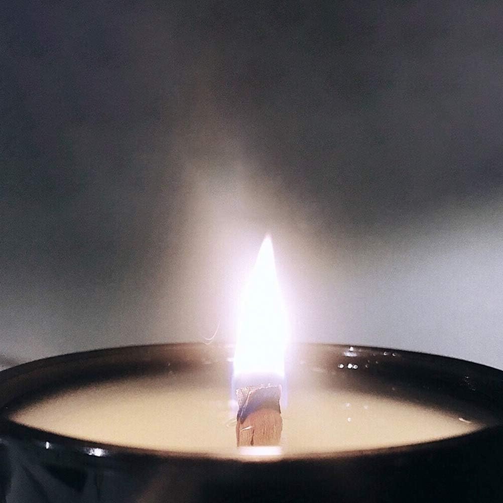 Wood wick burning in a container candle