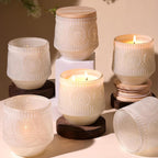 Six creamy-white floral glass candle jars