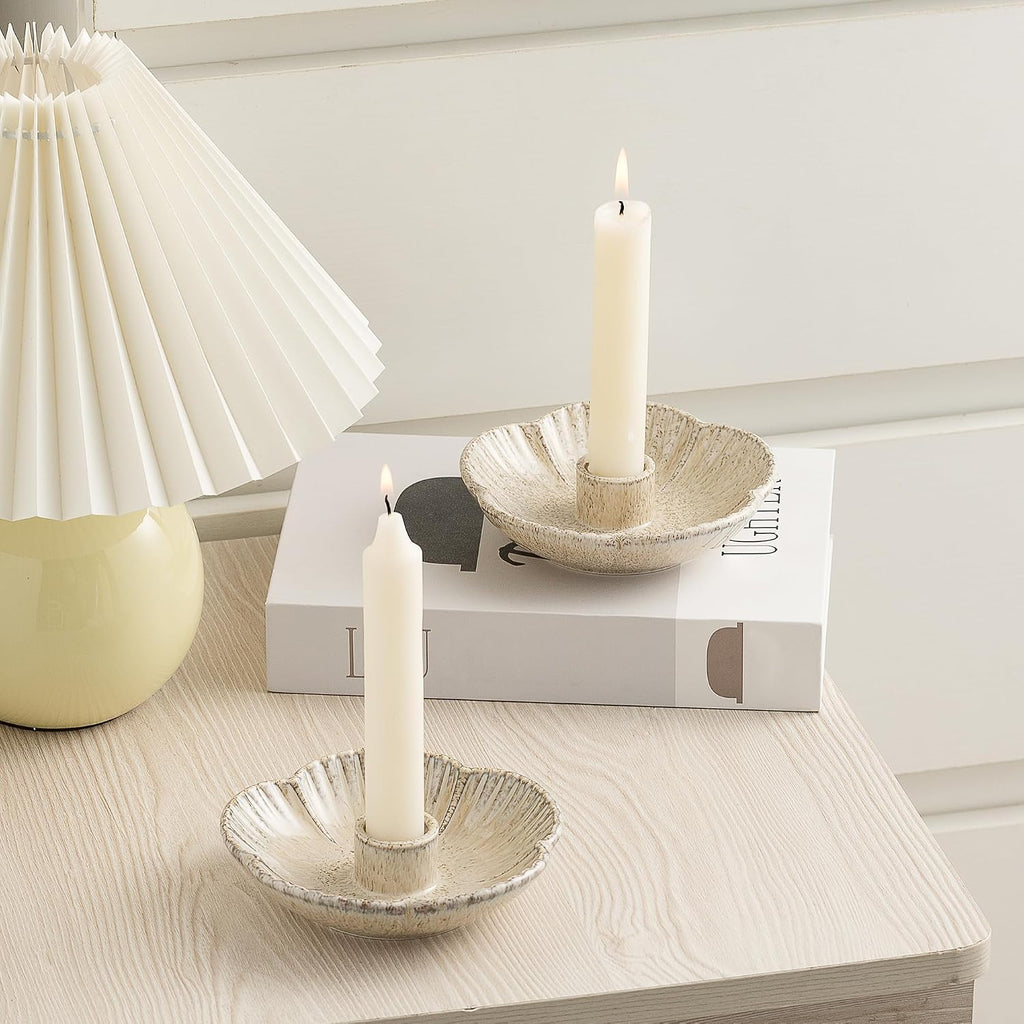Ceramic taper candle holder on a table