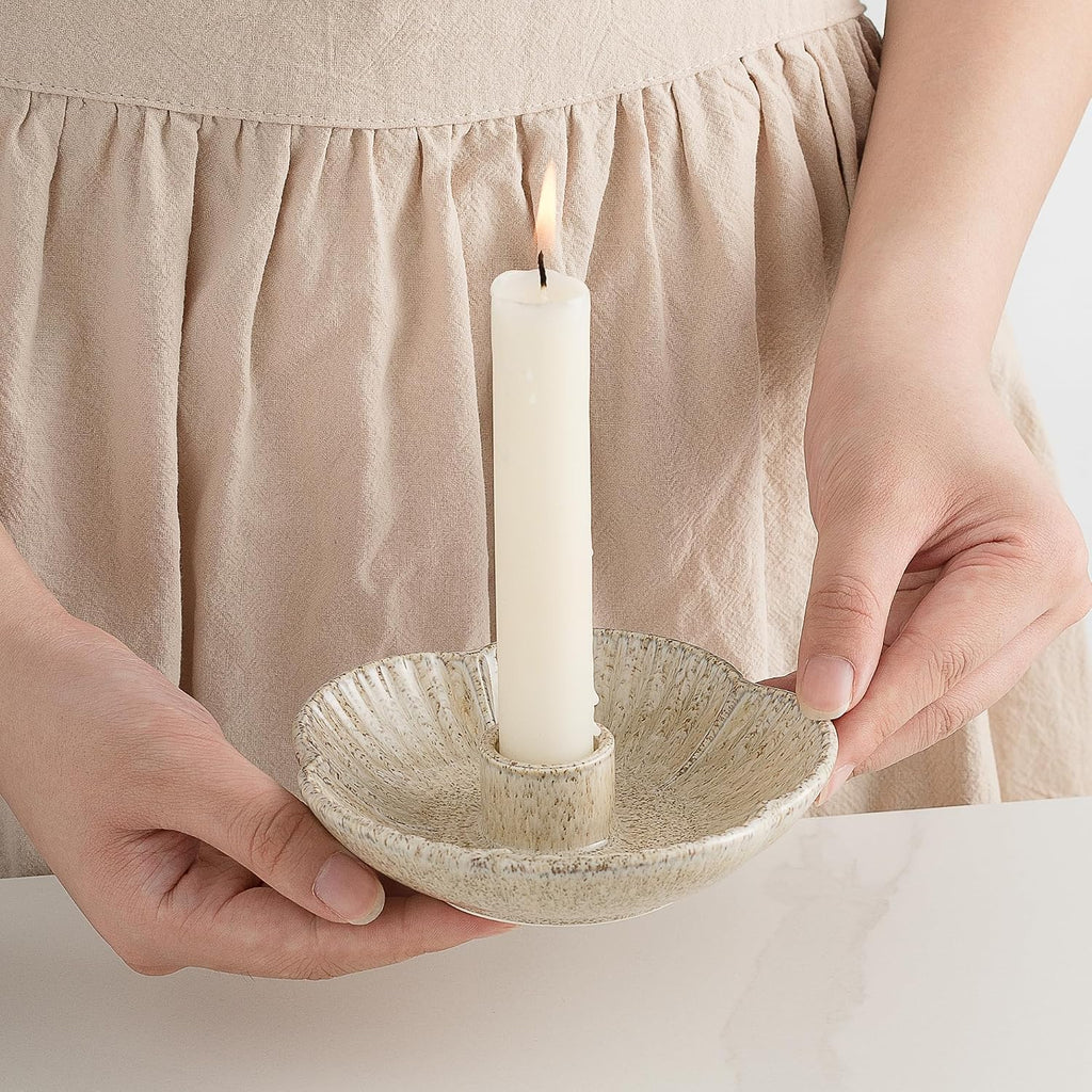 Ceramic taper holders on a dining table