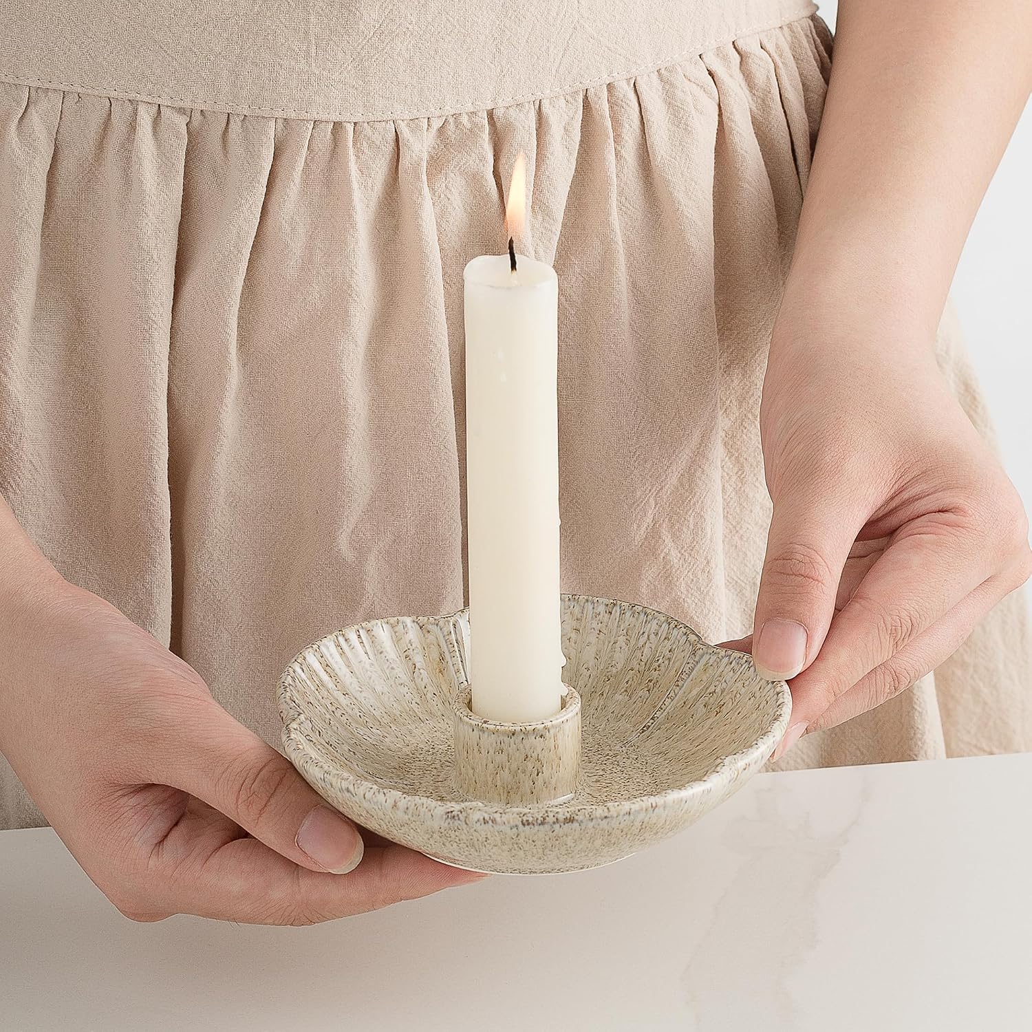 Ceramic taper holders on a dining table